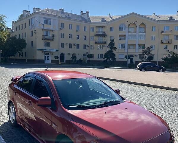 Червоний Міцубісі Lancer, об'ємом двигуна 2 л та пробігом 267 тис. км за 6500 $, фото 1 на Automoto.ua