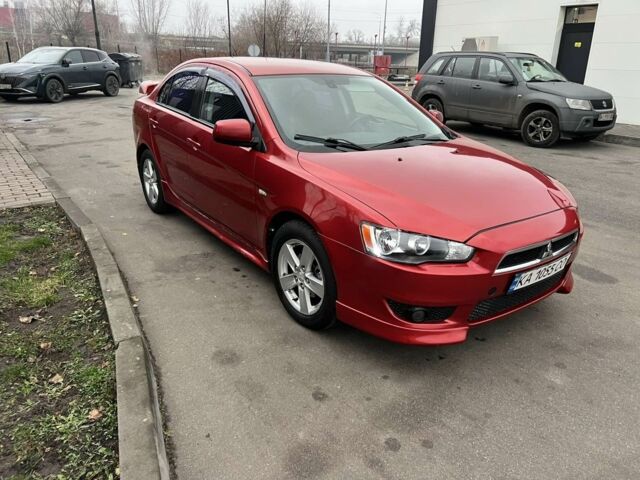 Красный Мицубиси Лансер, объемом двигателя 2 л и пробегом 300 тыс. км за 5700 $, фото 1 на Automoto.ua