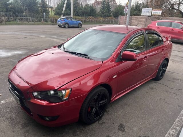 Червоний Міцубісі Lancer, об'ємом двигуна 2 л та пробігом 240 тис. км за 4900 $, фото 1 на Automoto.ua