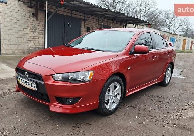 Красный Мицубиси Лансер, объемом двигателя 2 л и пробегом 120 тыс. км за 7800 $, фото 1 на Automoto.ua