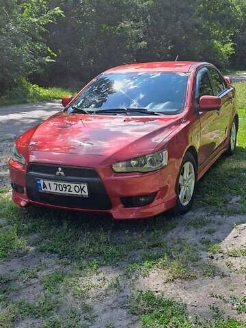 Червоний Міцубісі Lancer, об'ємом двигуна 2 л та пробігом 197 тис. км за 7300 $, фото 1 на Automoto.ua