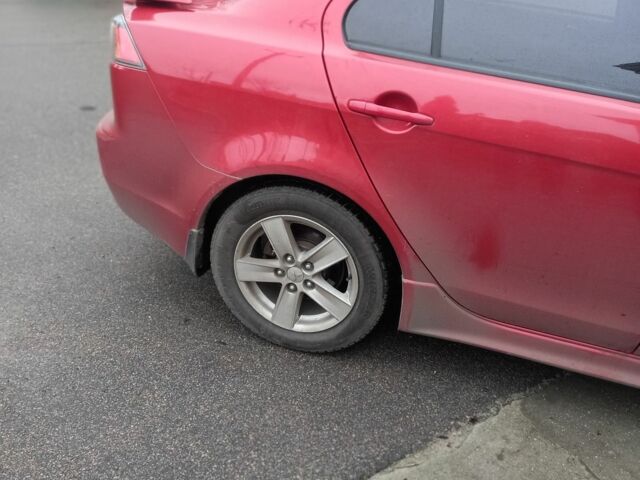 Червоний Міцубісі Lancer, об'ємом двигуна 2 л та пробігом 250 тис. км за 6500 $, фото 1 на Automoto.ua