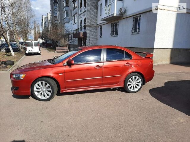 Червоний Міцубісі Lancer, об'ємом двигуна 2 л та пробігом 189 тис. км за 7500 $, фото 1 на Automoto.ua