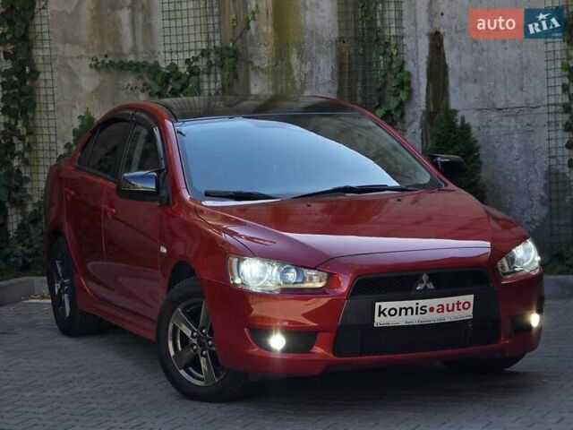 Червоний Міцубісі Lancer, об'ємом двигуна 2 л та пробігом 100 тис. км за 6999 $, фото 1 на Automoto.ua