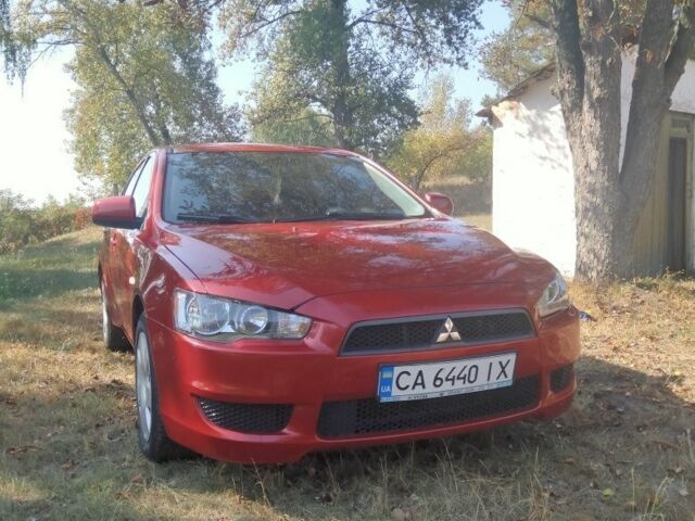 Червоний Міцубісі Lancer, об'ємом двигуна 1 л та пробігом 265 тис. км за 5850 $, фото 1 на Automoto.ua