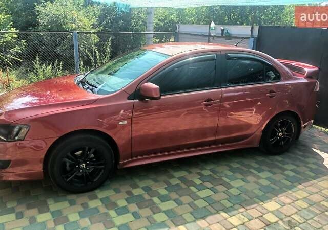 Червоний Міцубісі Lancer, об'ємом двигуна 2 л та пробігом 173 тис. км за 6900 $, фото 1 на Automoto.ua