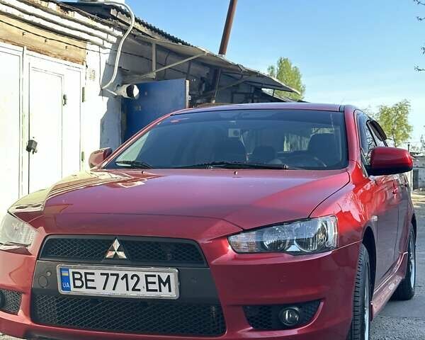 Червоний Міцубісі Lancer, об'ємом двигуна 2 л та пробігом 111 тис. км за 9700 $, фото 1 на Automoto.ua