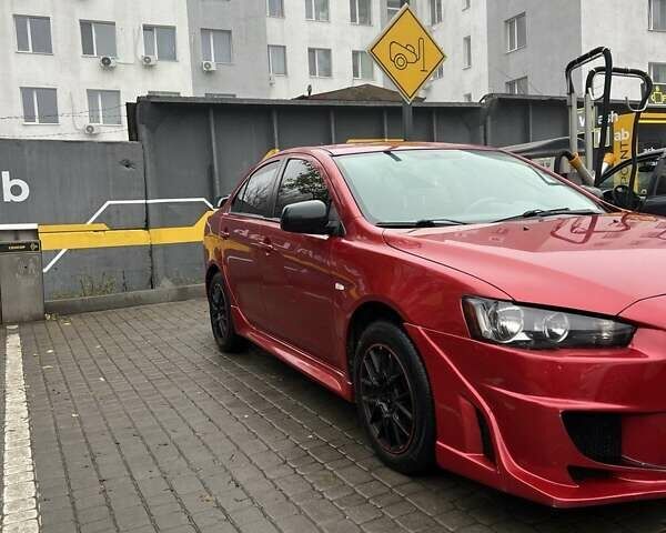 Красный Мицубиси Лансер, объемом двигателя 2 л и пробегом 230 тыс. км за 6700 $, фото 1 на Automoto.ua