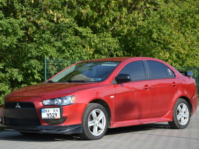 Червоний Міцубісі Lancer, об'ємом двигуна 2.4 л та пробігом 200 тис. км за 8900 $, фото 1 на Automoto.ua