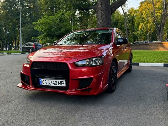 Красный Мицубиси Лансер, объемом двигателя 2 л и пробегом 260 тыс. км за 7300 $, фото 1 на Automoto.ua