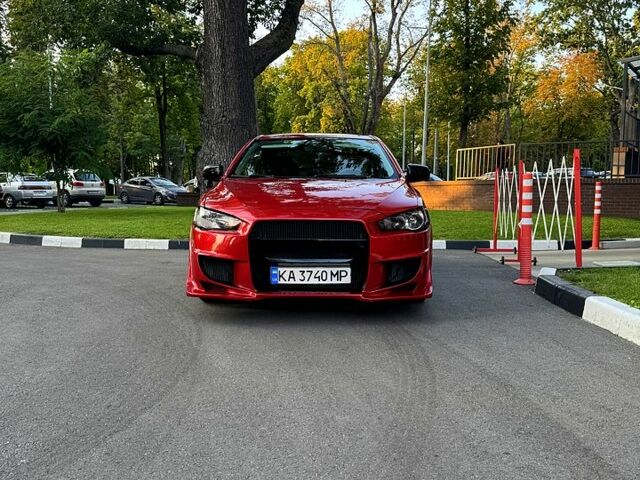 Мицубиси Лансер 2012 в Харькове на Automoto.ua Красный Мицубиси Лансер, объемом двигателя 2 л и пробегом 260 тыс. км за 6900 $, фото 1 на Automoto.ua