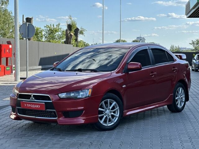 Красный Мицубиси Лансер, объемом двигателя 2 л и пробегом 185 тыс. км за 8699 $, фото 1 на Automoto.ua