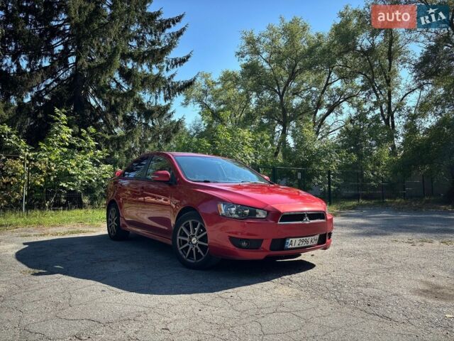 Червоний Міцубісі Lancer, об'ємом двигуна 2 л та пробігом 227 тис. км за 7800 $, фото 1 на Automoto.ua