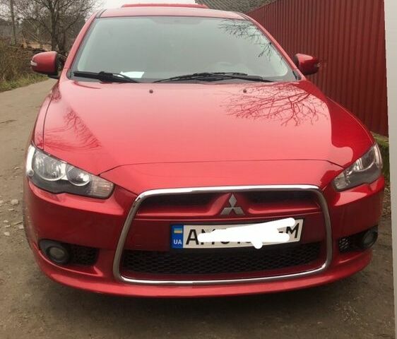 Червоний Міцубісі Lancer, об'ємом двигуна 2 л та пробігом 230 тис. км за 8500 $, фото 1 на Automoto.ua