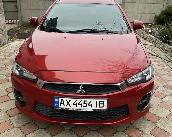 Красный Мицубиси Лансер, объемом двигателя 2 л и пробегом 134 тыс. км за 10500 $, фото 1 на Automoto.ua