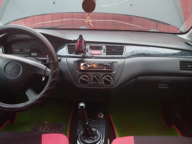 Червоний Міцубісі Lancer, об'ємом двигуна 1.6 л та пробігом 260 тис. км за 3000 $, фото 1 на Automoto.ua