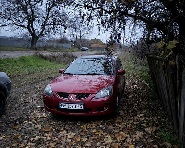 Червоний Міцубісі Lancer, об'ємом двигуна 1.6 л та пробігом 205 тис. км за 4400 $, фото 1 на Automoto.ua