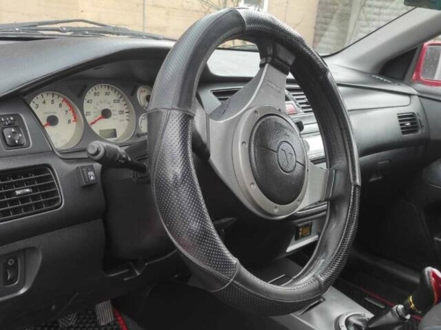 Червоний Міцубісі Lancer, об'ємом двигуна 2 л та пробігом 200 тис. км за 4500 $, фото 1 на Automoto.ua