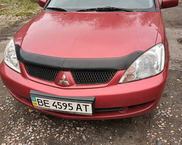 Красный Мицубиси Лансер, объемом двигателя 1.6 л и пробегом 217 тыс. км за 3750 $, фото 1 на Automoto.ua