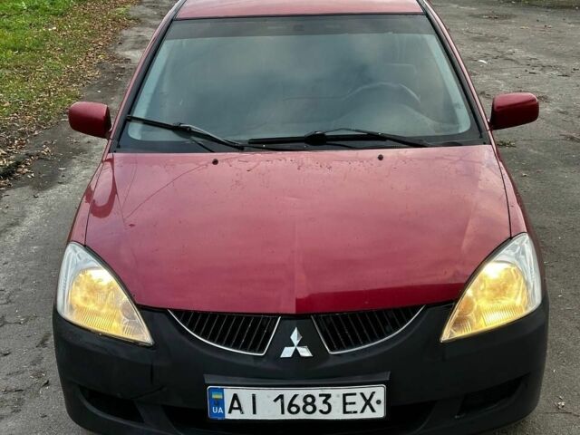 Красный Мицубиси Лансер, объемом двигателя 1.6 л и пробегом 290 тыс. км за 2800 $, фото 1 на Automoto.ua