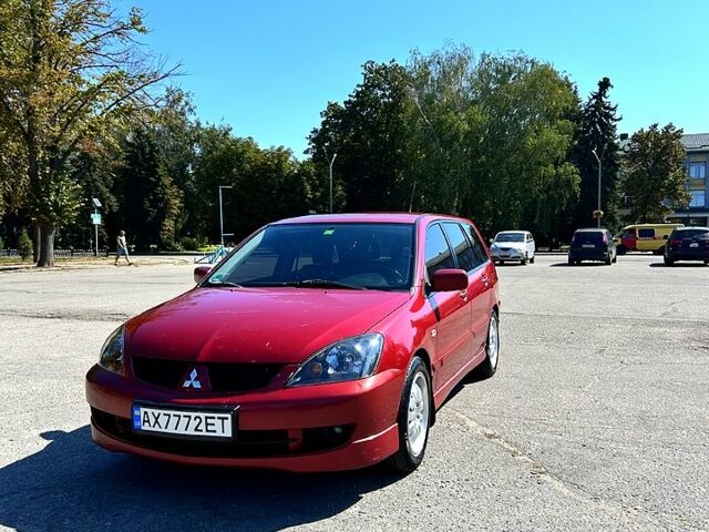 Красный Мицубиси Лансер, объемом двигателя 1.6 л и пробегом 24500 тыс. км за 3900 $, фото 1 на Automoto.ua