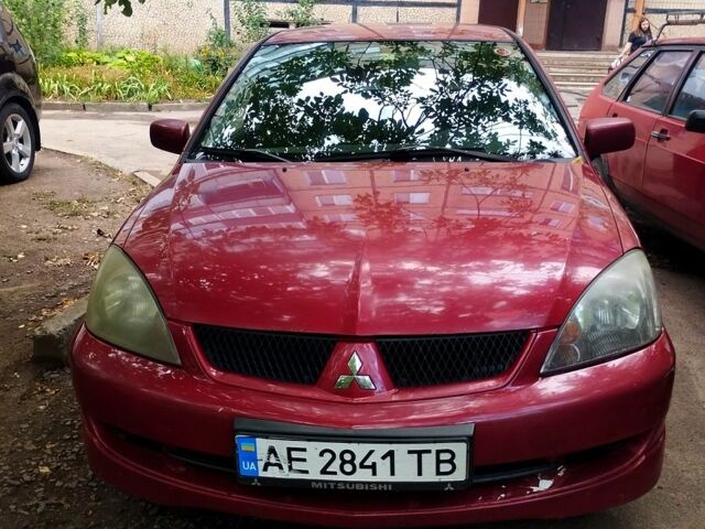 Красный Мицубиси Лансер, объемом двигателя 1.6 л и пробегом 225 тыс. км за 2500 $, фото 1 на Automoto.ua