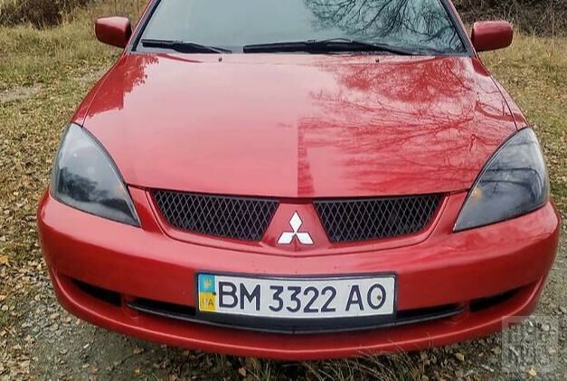 Червоний Міцубісі Lancer, об'ємом двигуна 1.6 л та пробігом 236 тис. км за 5500 $, фото 1 на Automoto.ua