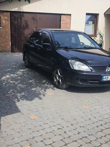 Мицубиси Лансер, объемом двигателя 1.58 л и пробегом 220 тыс. км за 4200 $, фото 1 на Automoto.ua