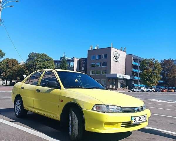 Жовтий Міцубісі Lancer, об'ємом двигуна 1.3 л та пробігом 306 тис. км за 1500 $, фото 1 на Automoto.ua