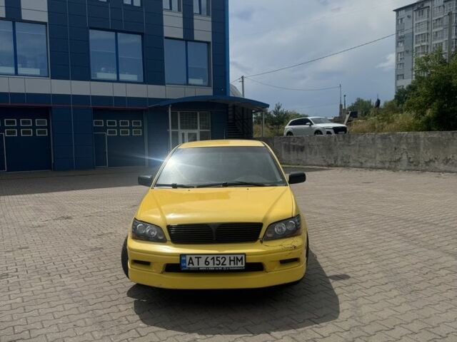 Жовтий Міцубісі Lancer, об'ємом двигуна 2 л та пробігом 262 тис. км за 3300 $, фото 1 на Automoto.ua
