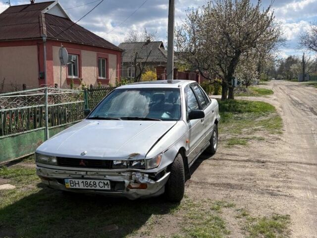 Серый Мицубиси Лансер, объемом двигателя 2 л и пробегом 200 тыс. км за 1000 $, фото 1 на Automoto.ua