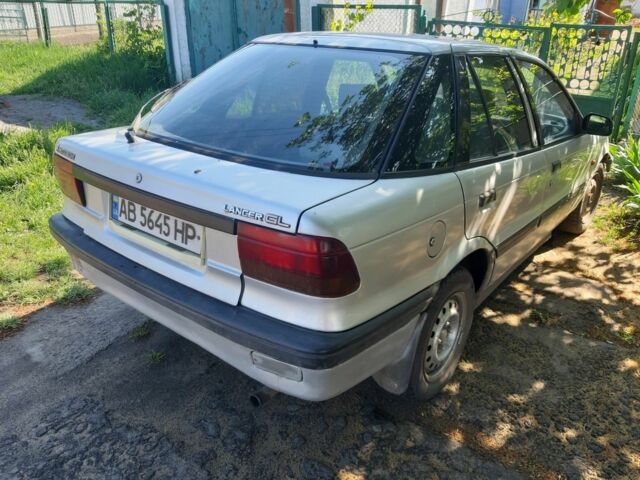 Серый Мицубиси Лансер, объемом двигателя 1.5 л и пробегом 374 тыс. км за 1100 $, фото 1 на Automoto.ua