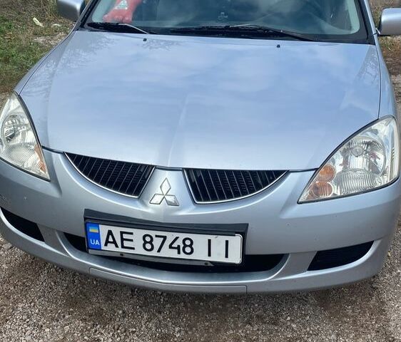 Серый Мицубиси Лансер, объемом двигателя 1.6 л и пробегом 289 тыс. км за 3150 $, фото 1 на Automoto.ua