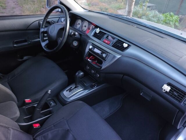 Серый Мицубиси Лансер, объемом двигателя 1.6 л и пробегом 98 тыс. км за 4800 $, фото 1 на Automoto.ua