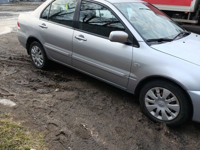 Серый Мицубиси Лансер, объемом двигателя 1.6 л и пробегом 200 тыс. км за 3000 $, фото 1 на Automoto.ua