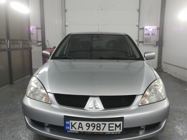 Серый Мицубиси Лансер, объемом двигателя 1.6 л и пробегом 330 тыс. км за 3900 $, фото 1 на Automoto.ua