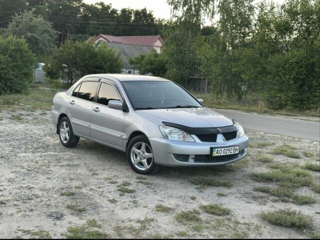 Серый Мицубиси Лансер, объемом двигателя 1.6 л и пробегом 197 тыс. км за 4200 $, фото 1 на Automoto.ua