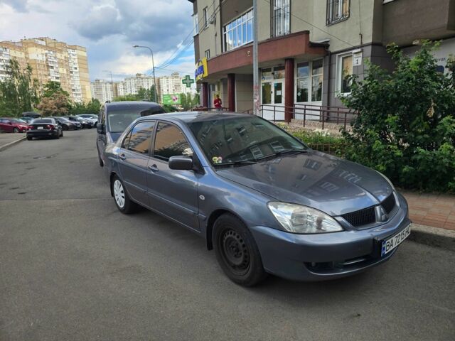 Серый Мицубиси Лансер, объемом двигателя 1.6 л и пробегом 299 тыс. км за 3200 $, фото 1 на Automoto.ua