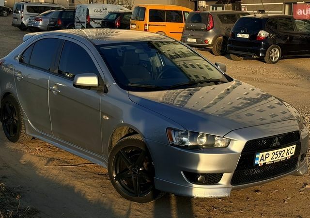 Серый Мицубиси Лансер, объемом двигателя 1.8 л и пробегом 309 тыс. км за 6400 $, фото 1 на Automoto.ua