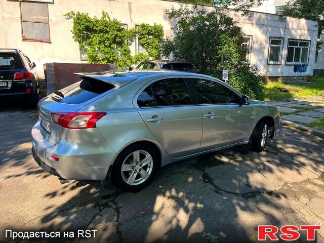 Серый Мицубиси Лансер, объемом двигателя 1.8 л и пробегом 246 тыс. км за 5600 $, фото 1 на Automoto.ua