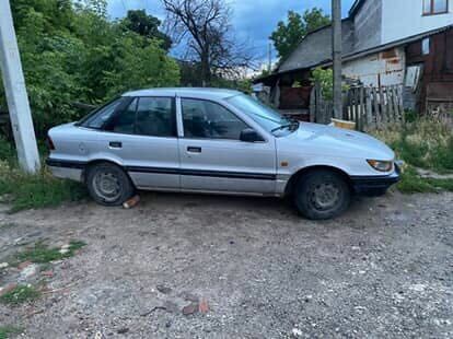 Сірий Міцубісі Lancer, об'ємом двигуна 1.5 л та пробігом 678 тис. км за 474 $, фото 1 на Automoto.ua