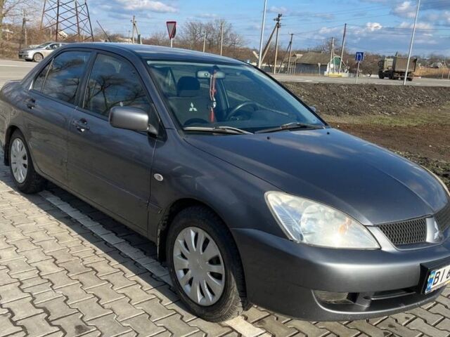 Сірий Міцубісі Lancer, об'ємом двигуна 1.6 л та пробігом 255 тис. км за 4200 $, фото 1 на Automoto.ua