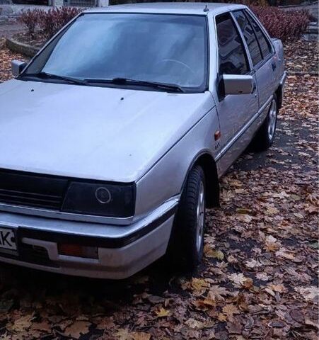 Сірий Міцубісі Lancer, об'ємом двигуна 1.5 л та пробігом 290 тис. км за 600 $, фото 1 на Automoto.ua