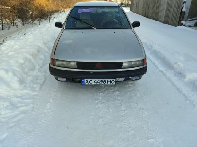 Серый Мицубиси Лансер, объемом двигателя 1.5 л и пробегом 80 тыс. км за 900 $, фото 1 на Automoto.ua