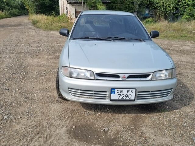 Сірий Міцубісі Lancer, об'ємом двигуна 1.3 л та пробігом 1 тис. км за 2000 $, фото 1 на Automoto.ua