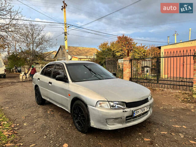 Сірий Міцубісі Lancer, об'ємом двигуна 1.3 л та пробігом 302 тис. км за 950 $, фото 1 на Automoto.ua