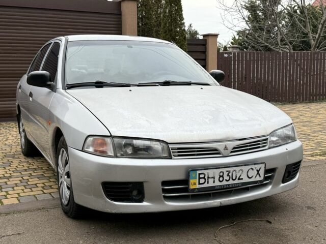 Серый Мицубиси Лансер, объемом двигателя 1.3 л и пробегом 320 тыс. км за 1450 $, фото 1 на Automoto.ua