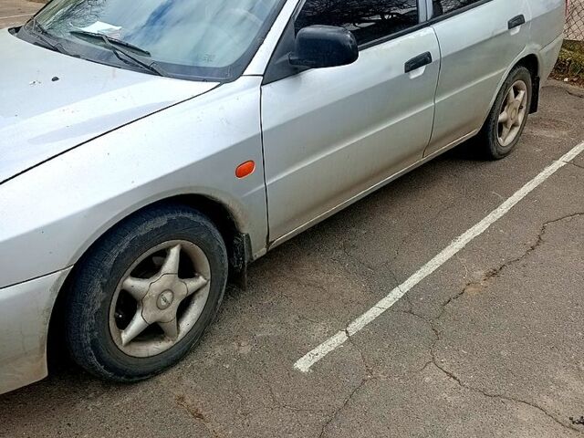 Серый Мицубиси Лансер, объемом двигателя 1.3 л и пробегом 360 тыс. км за 1750 $, фото 1 на Automoto.ua