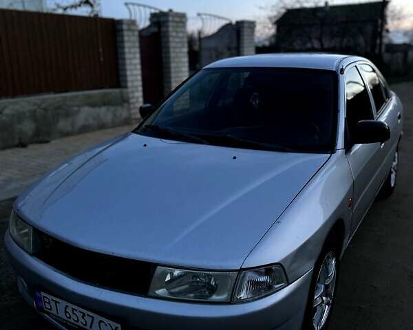 Сірий Міцубісі Lancer, об'ємом двигуна 1.3 л та пробігом 295 тис. км за 2900 $, фото 1 на Automoto.ua