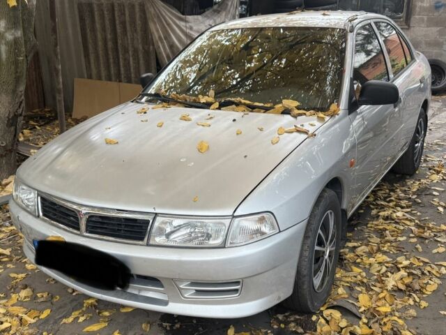 Сірий Міцубісі Lancer, об'ємом двигуна 1.3 л та пробігом 555 тис. км за 875 $, фото 1 на Automoto.ua